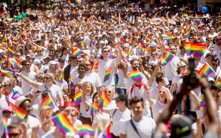 Apple employees carry rainbow flags as they march in the San Francisco Gay Pride Festival in California June 29, 2014 | REUTERS/Noah Berger