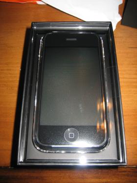 iPhone packaging open revealing the phone