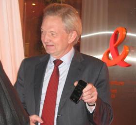 Louise-Pierre Wenes, Senior Executive Vice-President of France Telecom, holds iPhone on launch day.